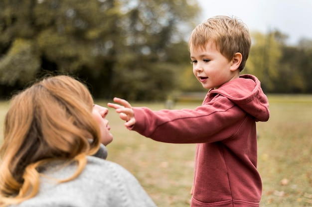 close-up-mother-son-playing_23-2148748700