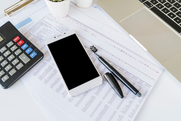 desk-office-accountant-with-calculator-smartphone_23-2147965620